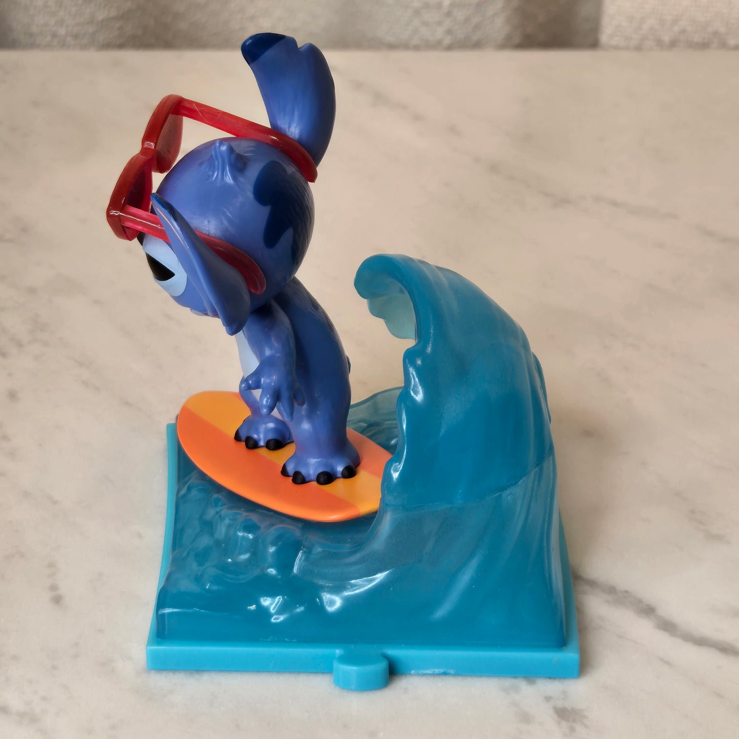 blue dog figure (surfing)