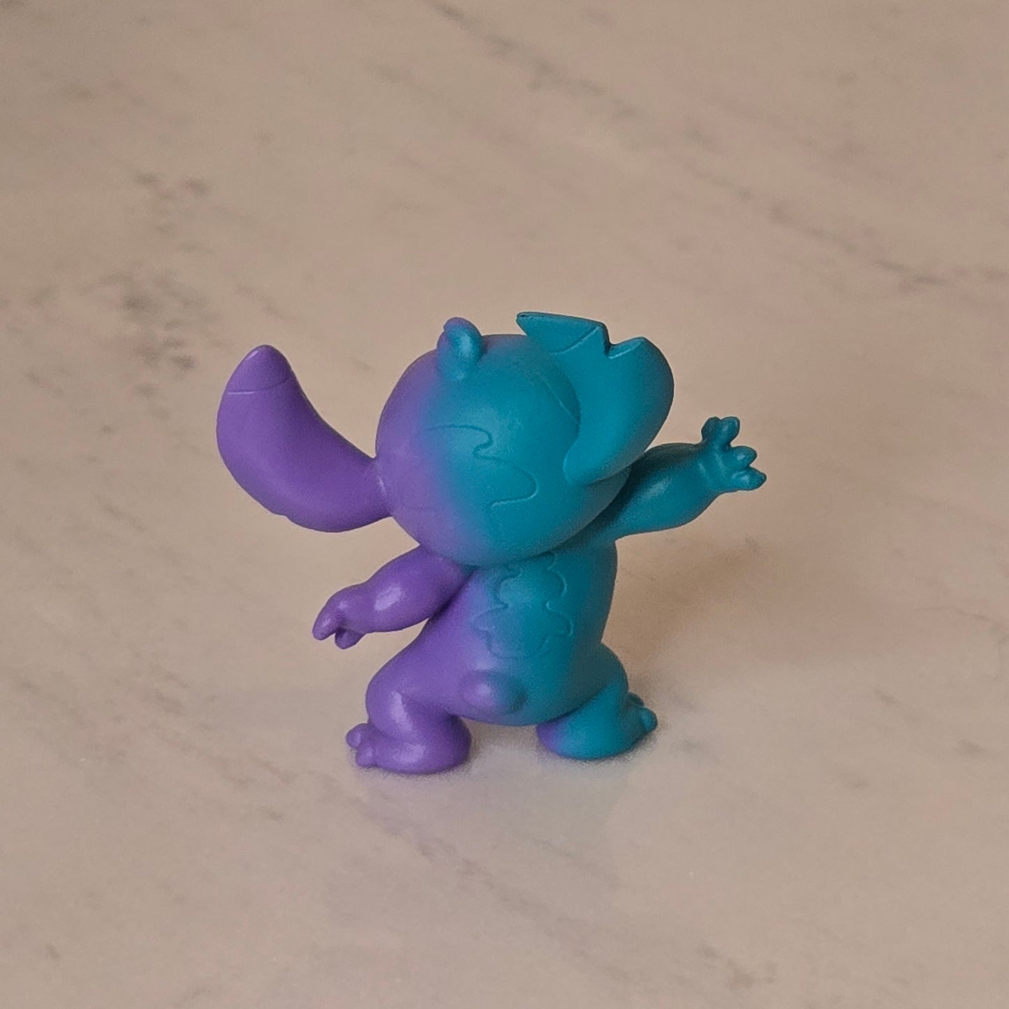 blue dog figure (blue and purple)