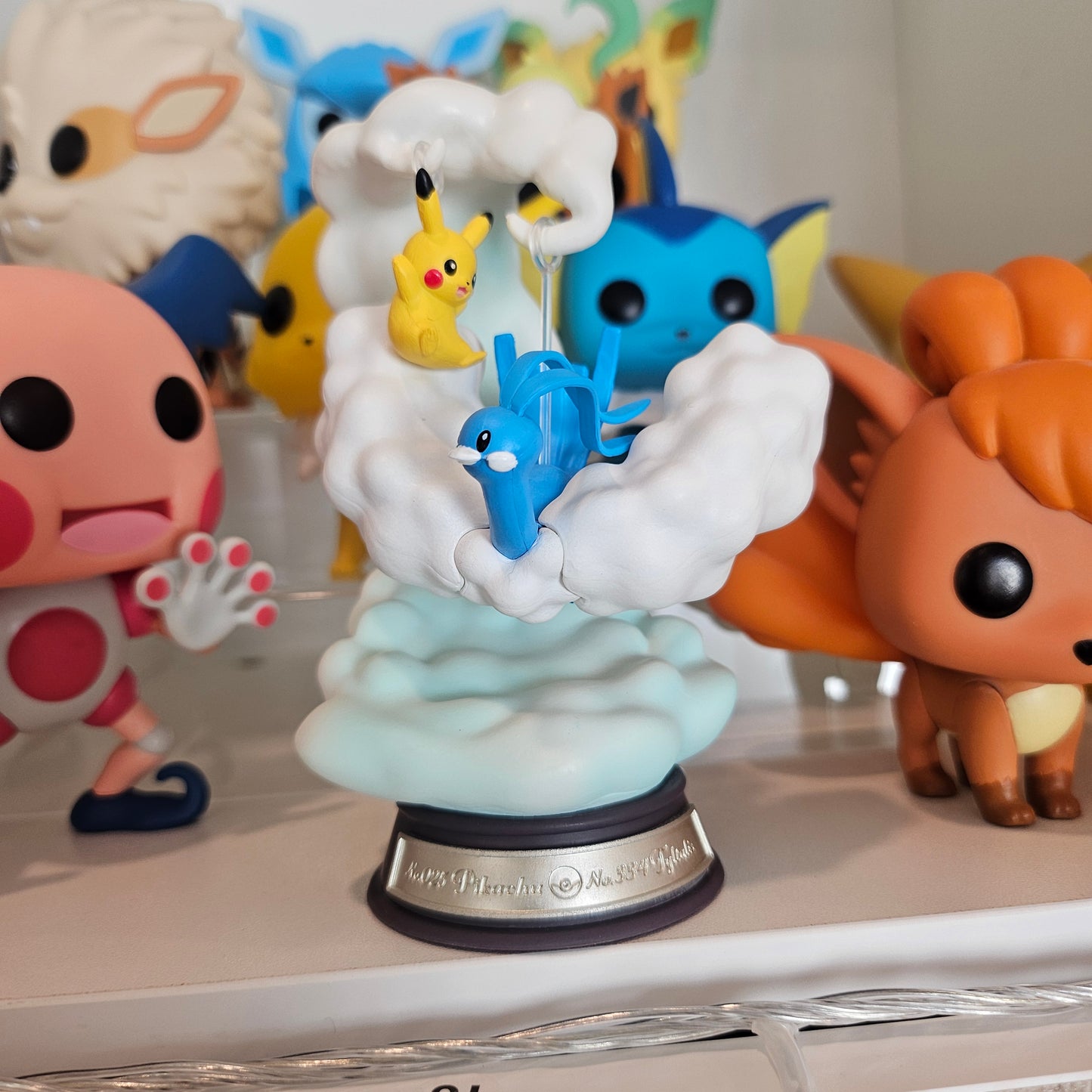 electric mouse and cloudy bird figure