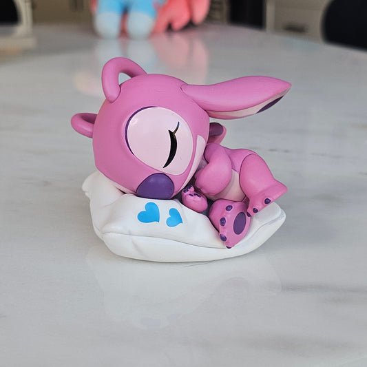 sleeping pink dog popmart figure