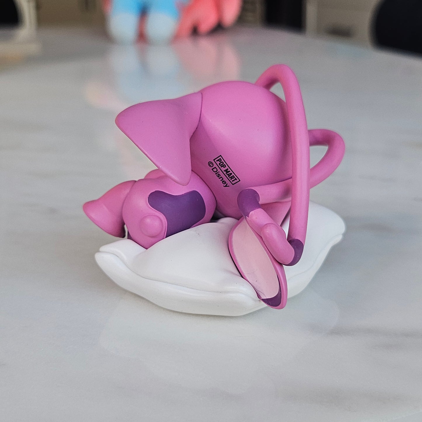 sleeping pink dog popmart figure