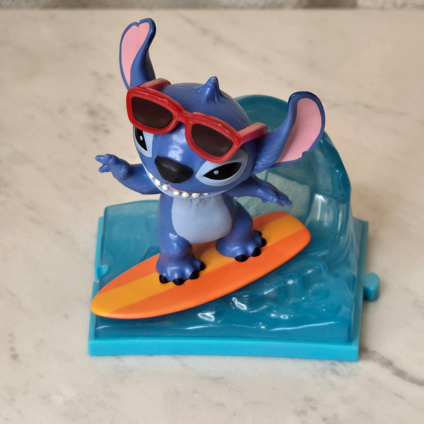 blue dog figure (surfing)