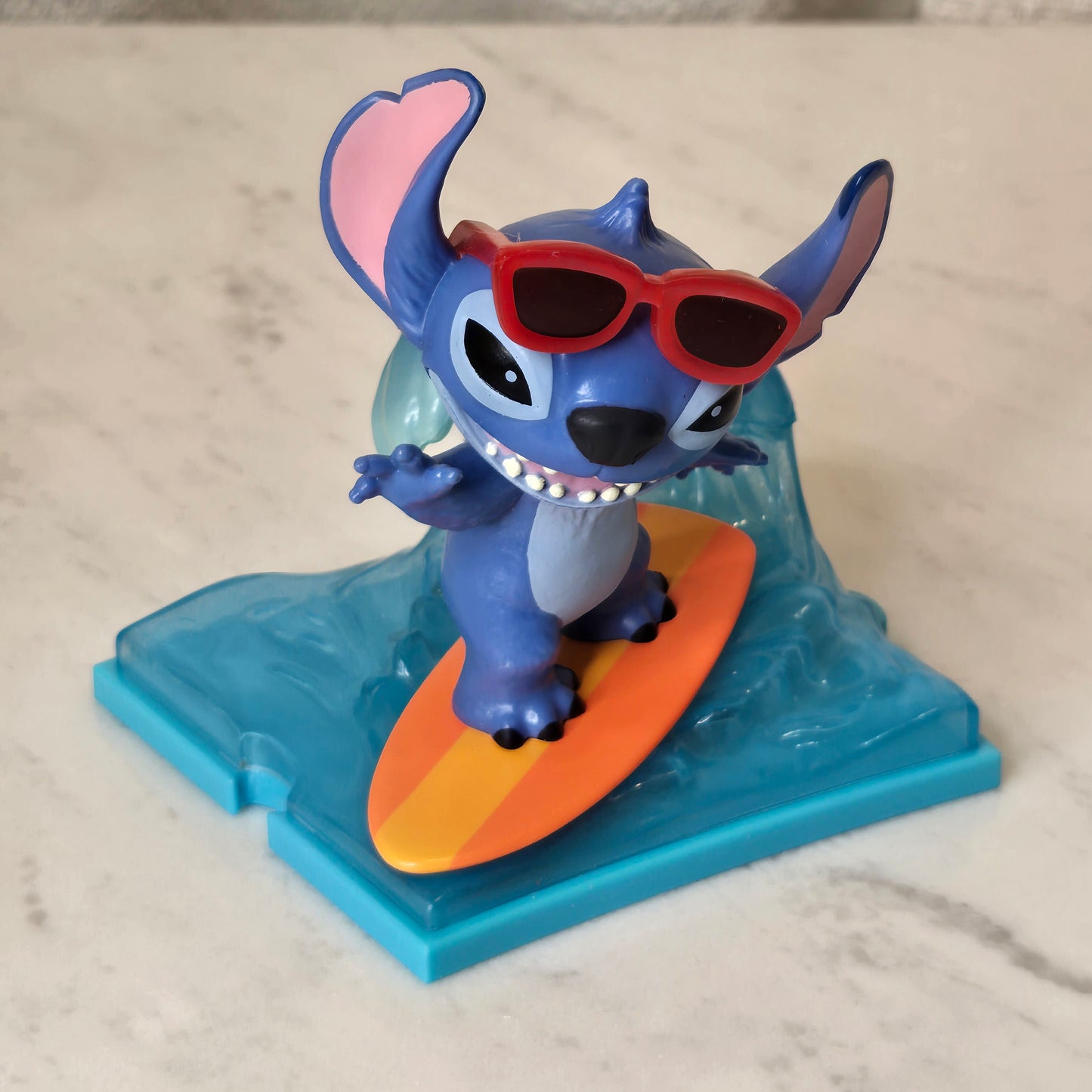 blue dog figure (surfing)