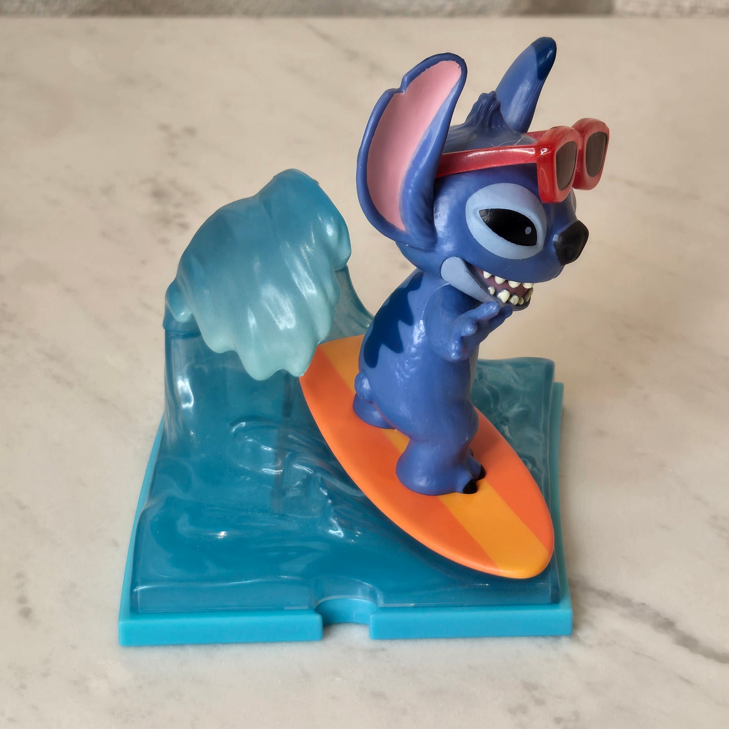 blue dog figure (surfing)