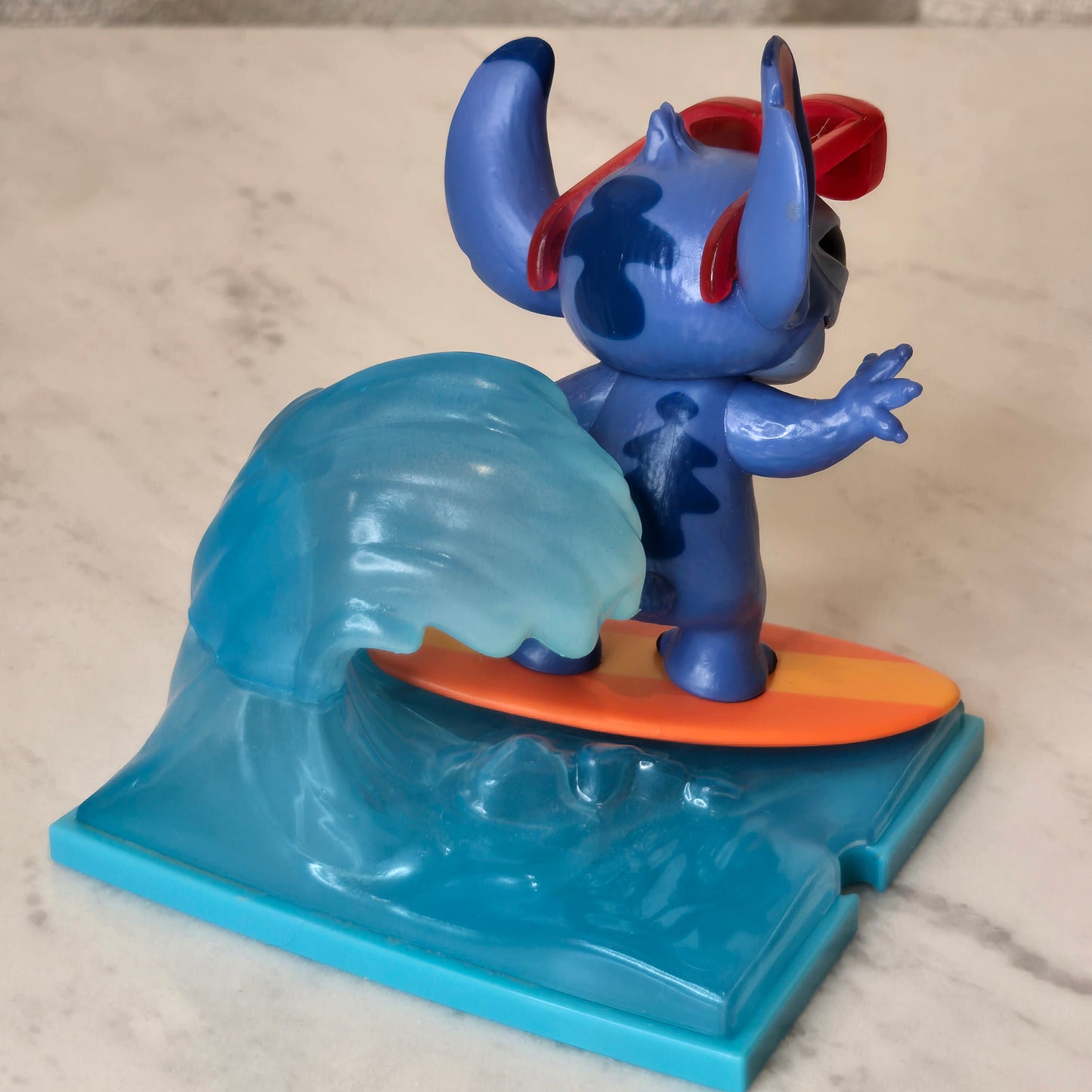 blue dog figure (surfing)