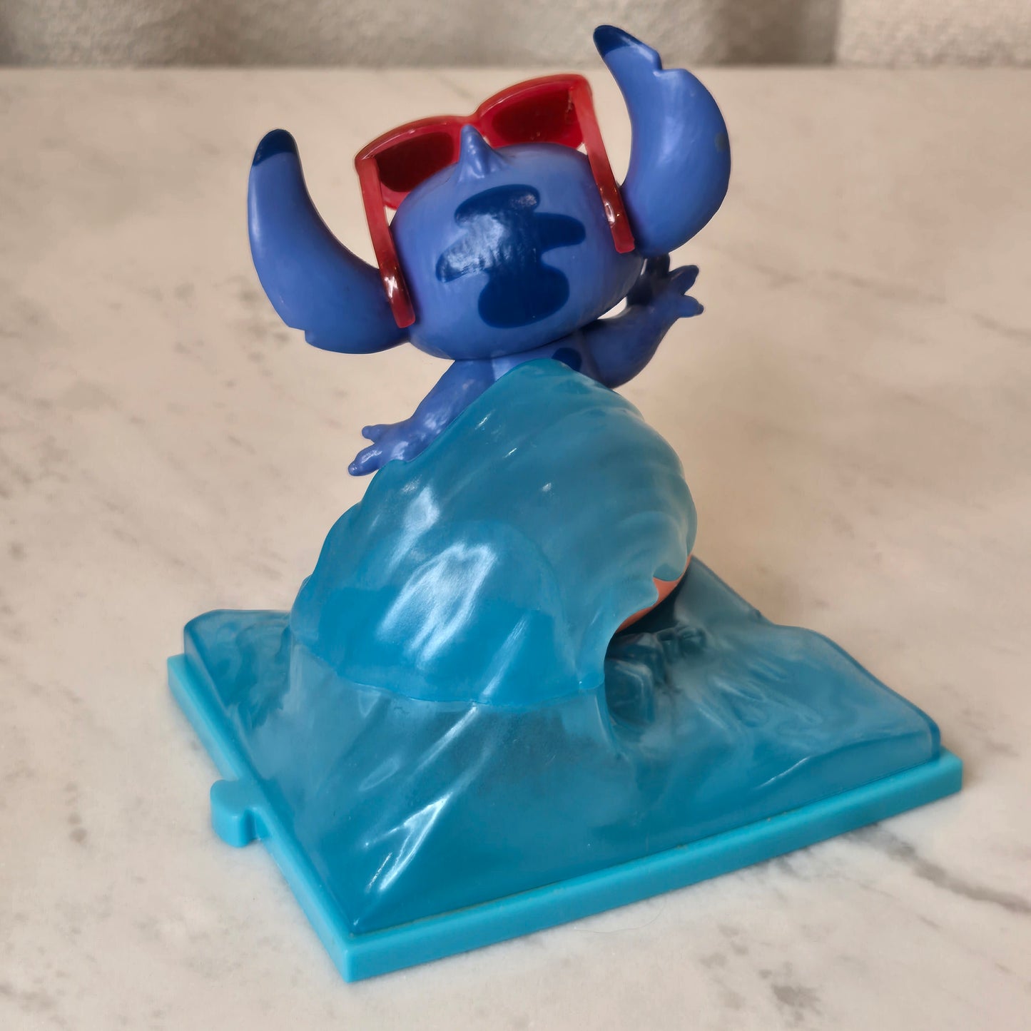 blue dog figure (surfing)