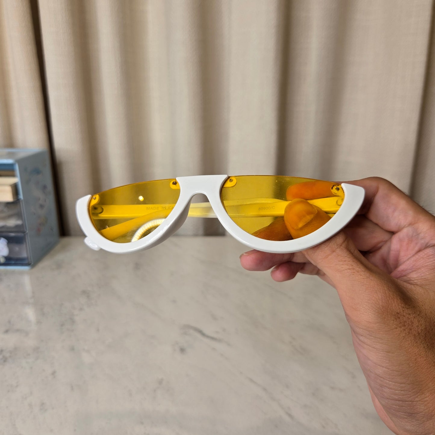 white sunnies with yellow lens