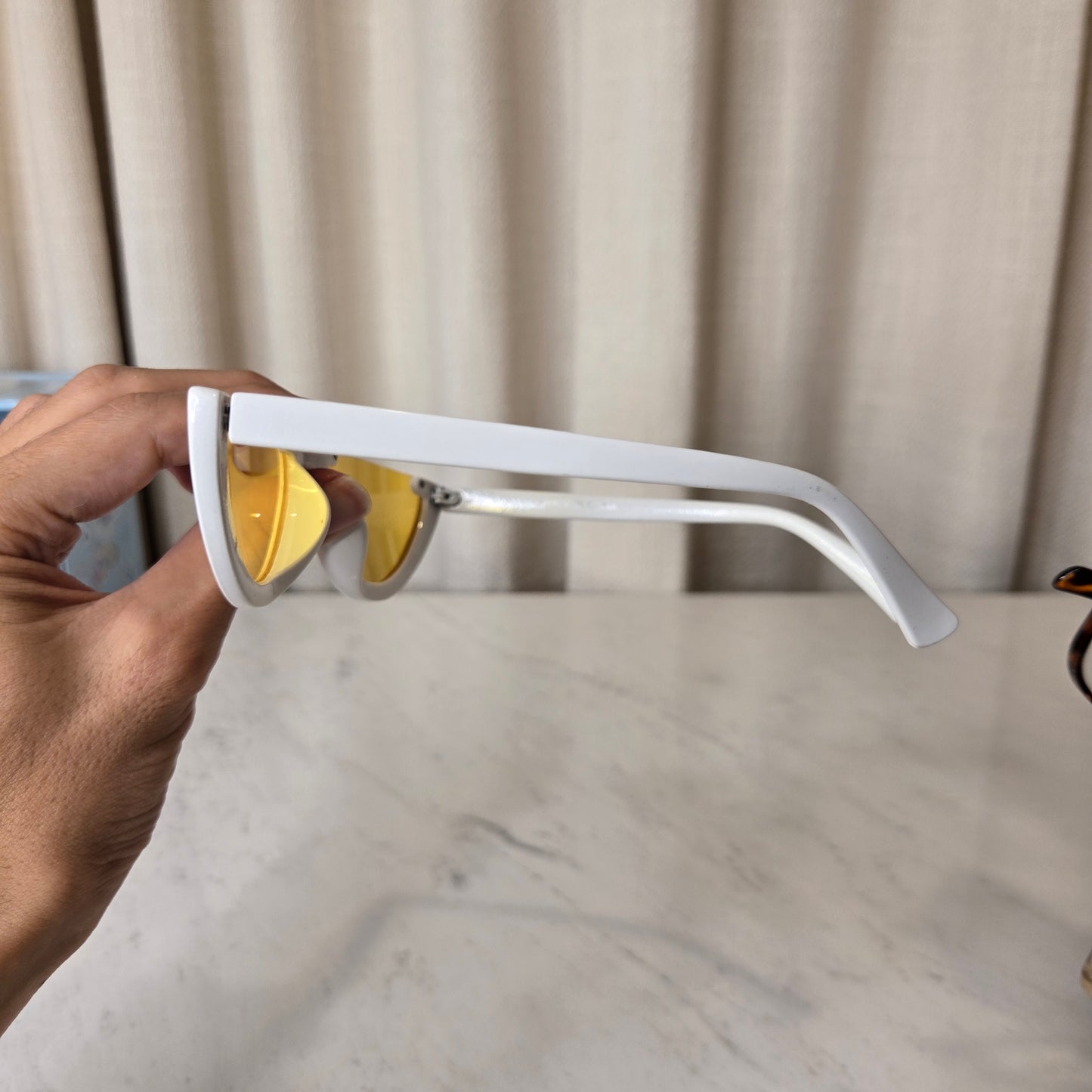 white sunnies with yellow lens