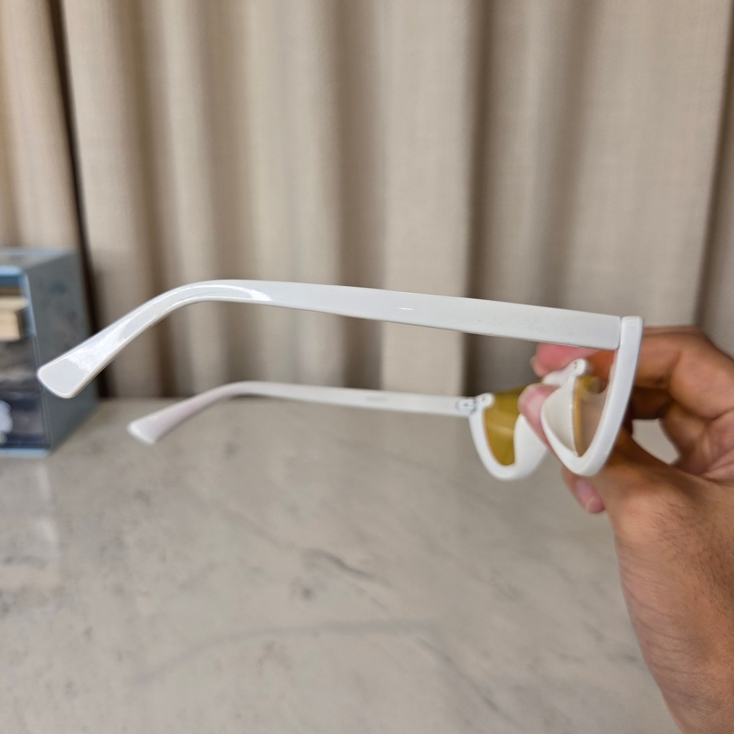 white sunnies with yellow lens