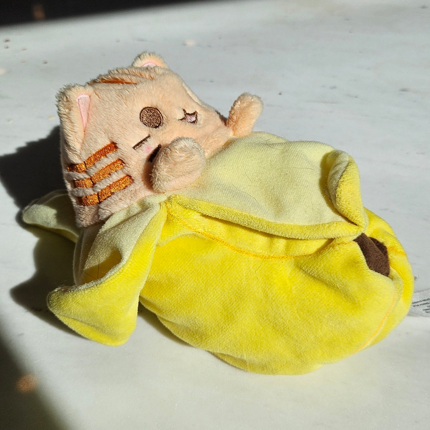 banana cat plushie (orange tabby)