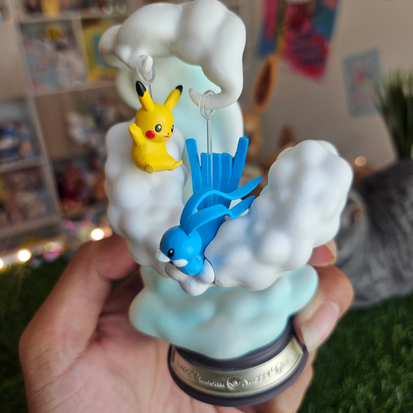 electric mouse and cloudy bird figure