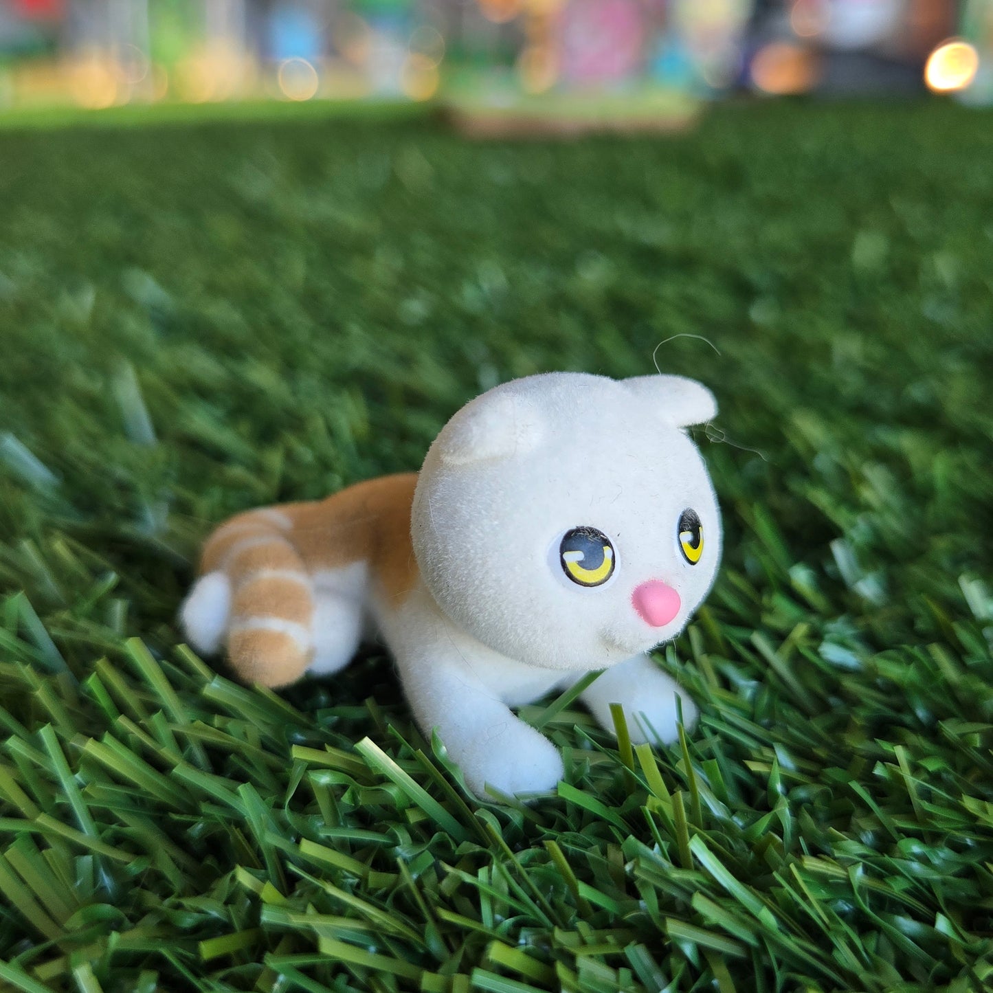 orange and white cat figure