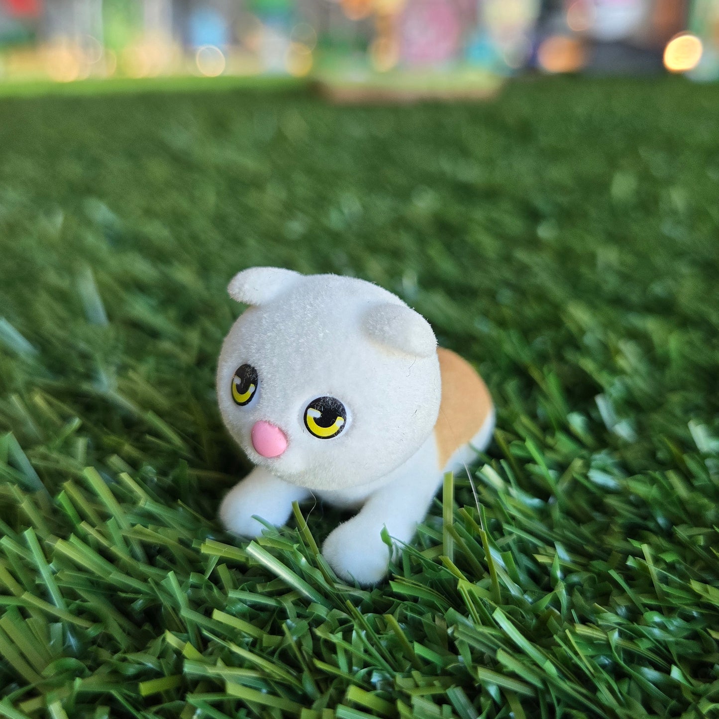 orange and white cat figure