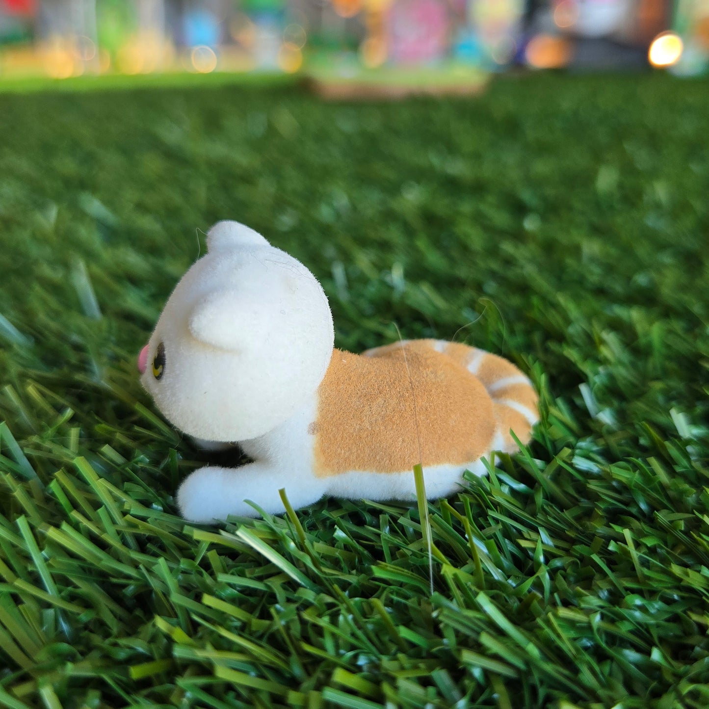 orange and white cat figure