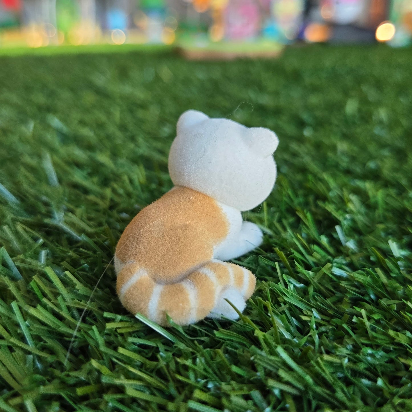 orange and white cat figure