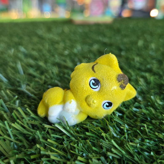yellow cat lying down figure