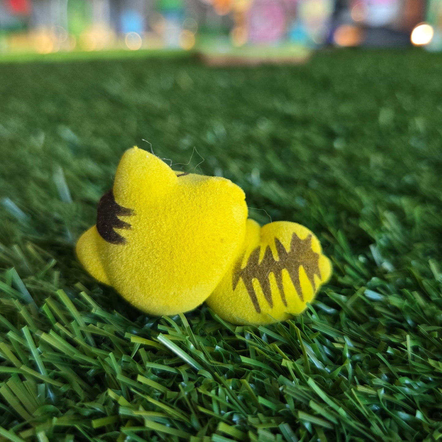yellow cat lying down figure