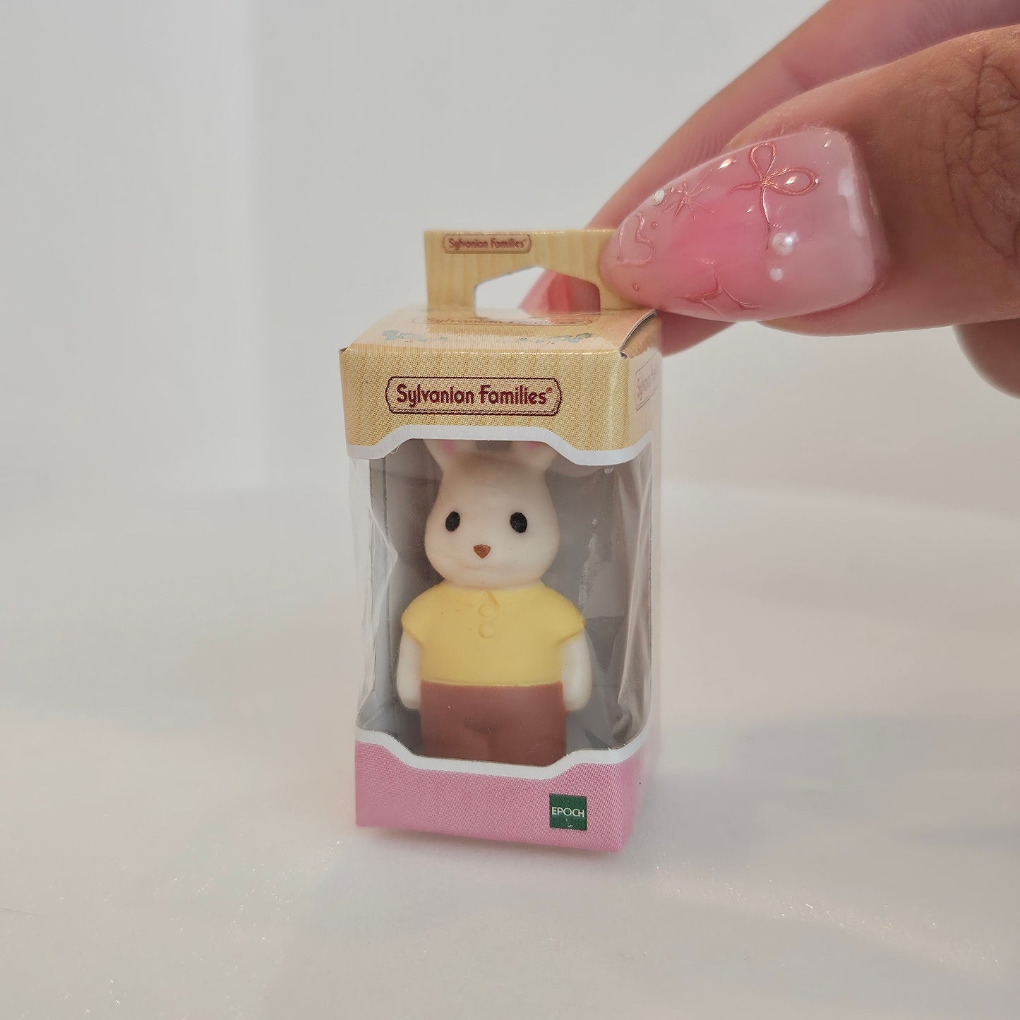 tiny bunny in box (yellow shirt)