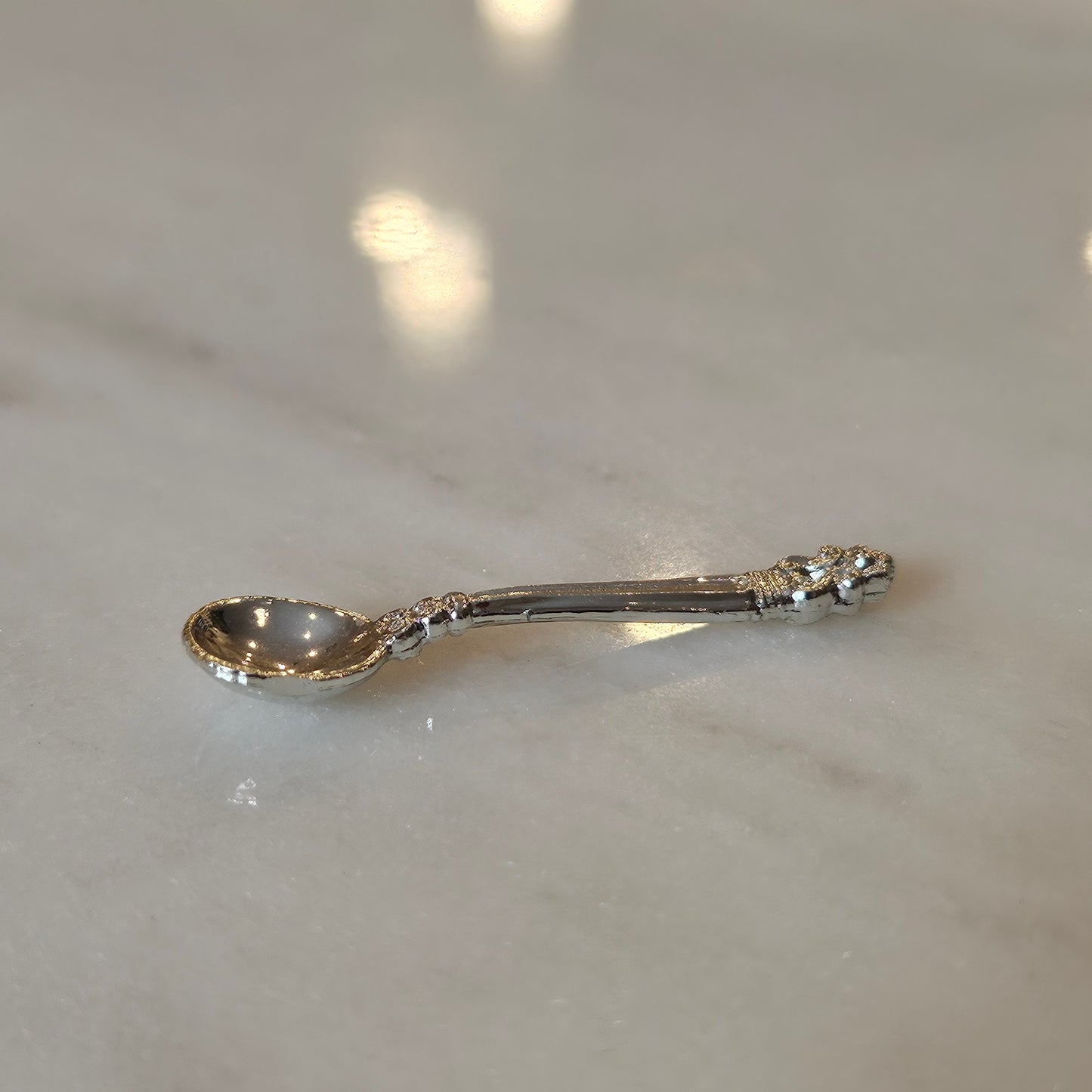 tiny silver spoon