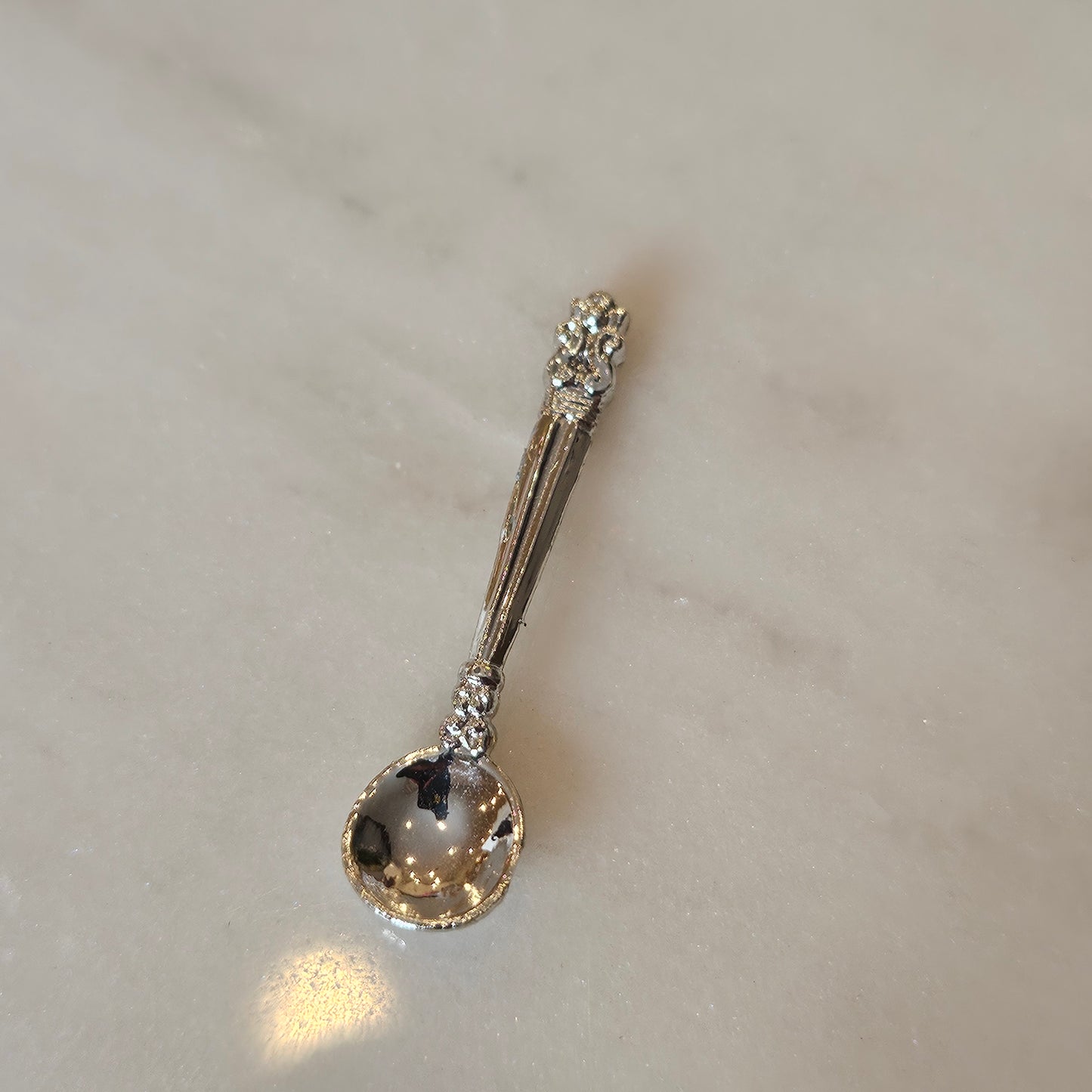 tiny silver spoon