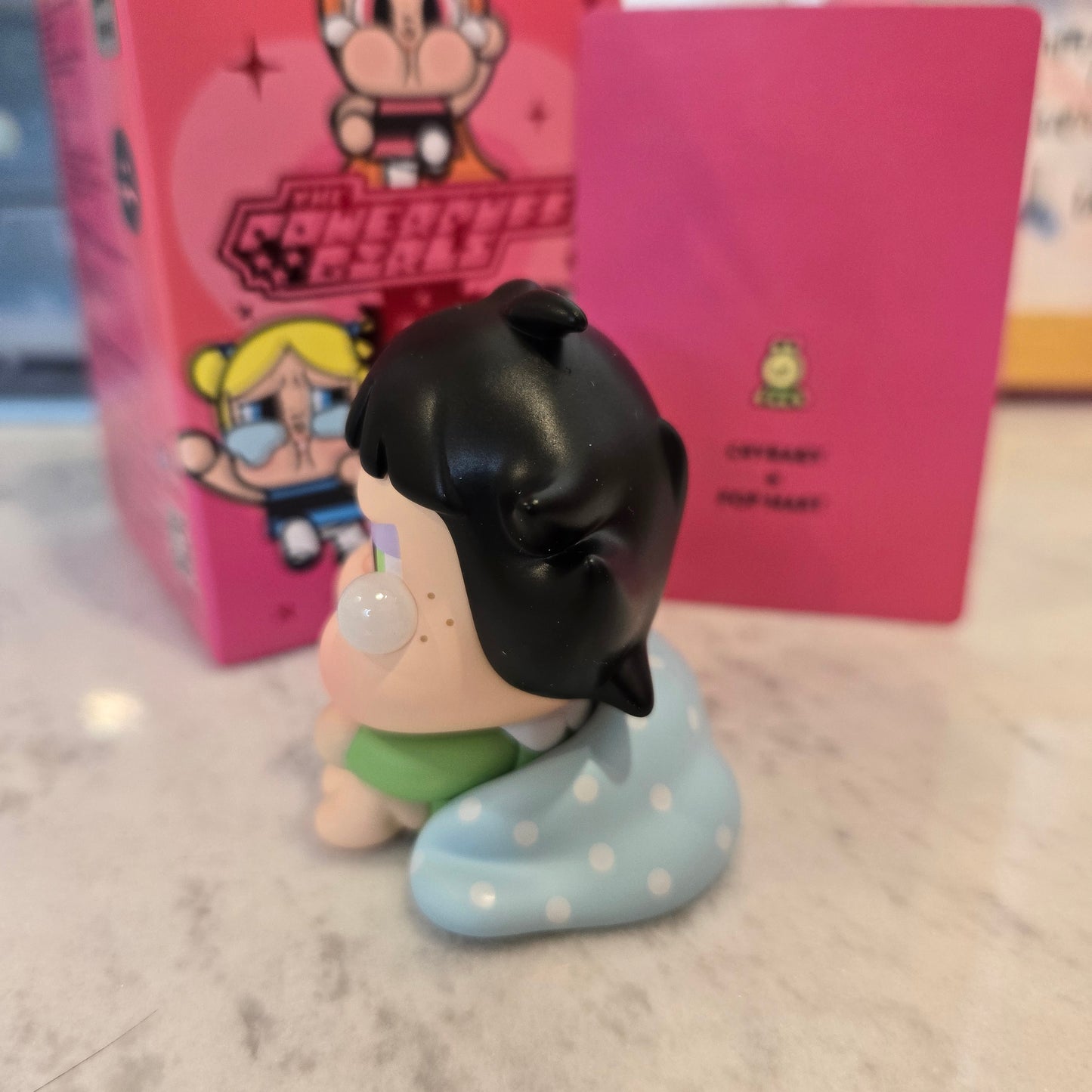 crying green with blanket
