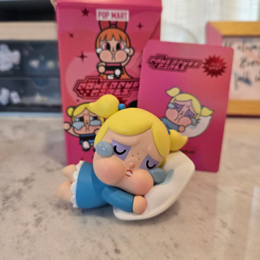crying blue with pillow